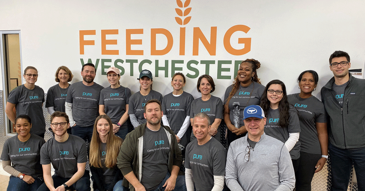 Group of PURE employees volunteering at Feeding Westchester