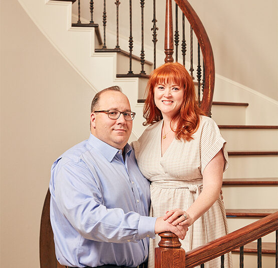 PURE Members Christina and Craig on their staircase in their home.