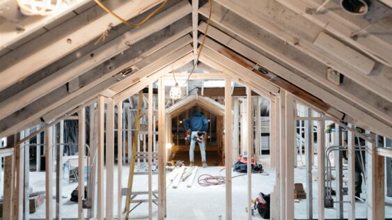 Worker in home under construction