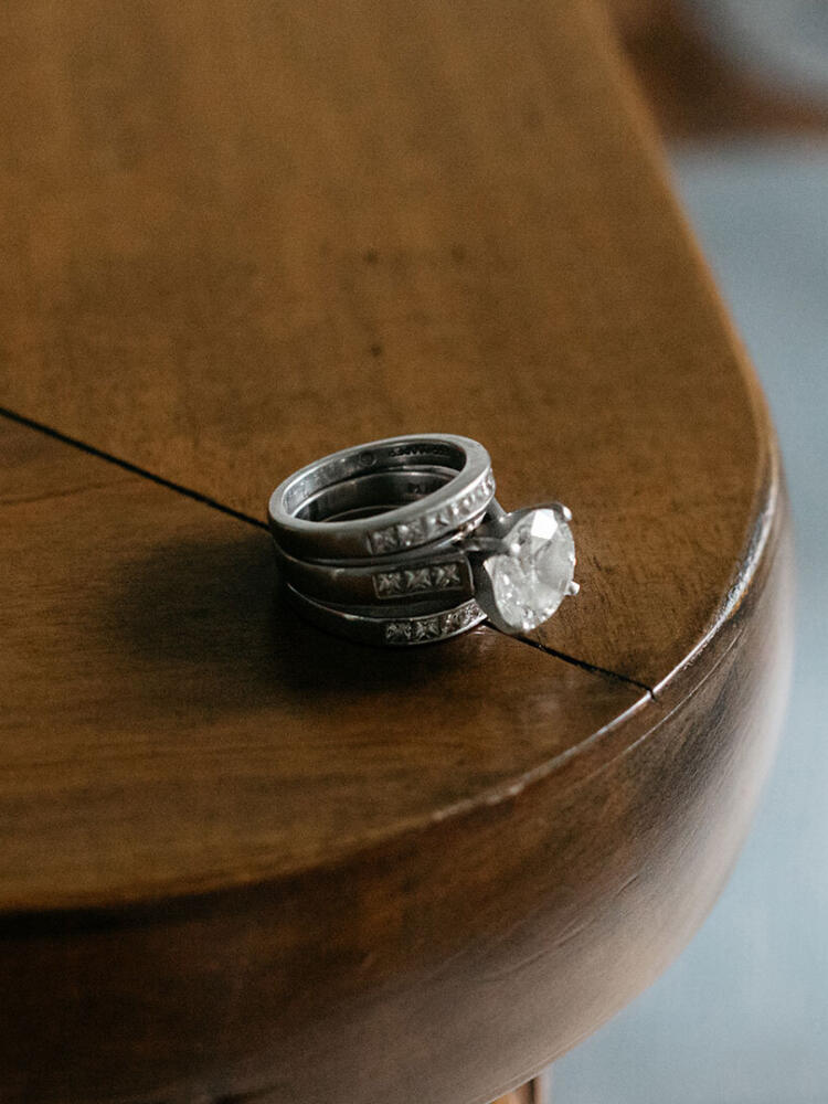 A close up photo of a diamond ring on a table