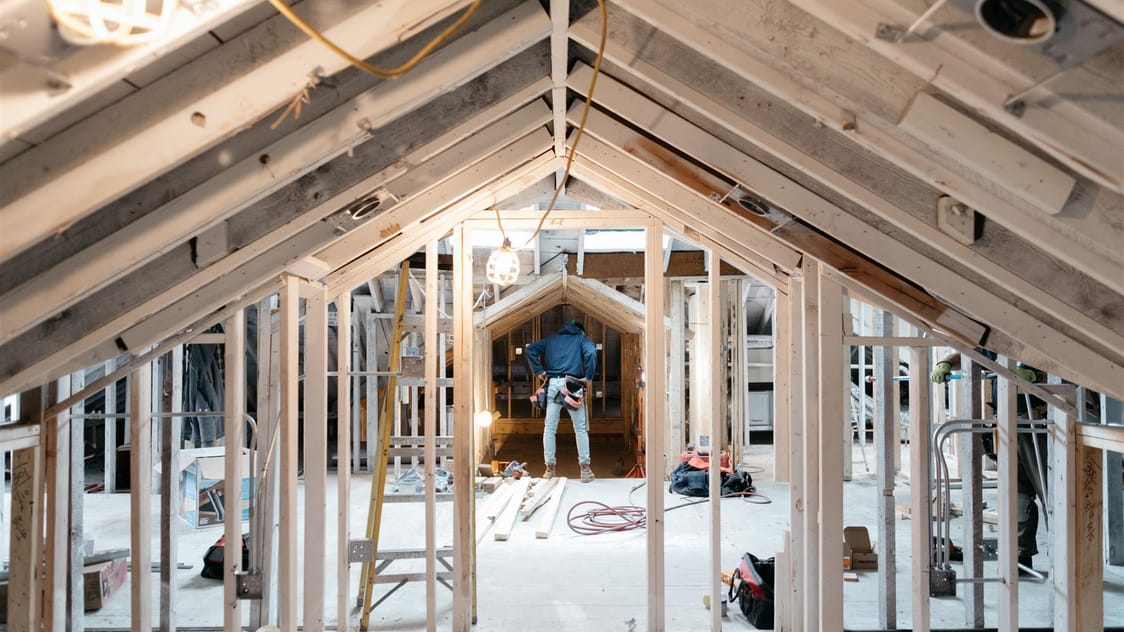 Worker in home under construction